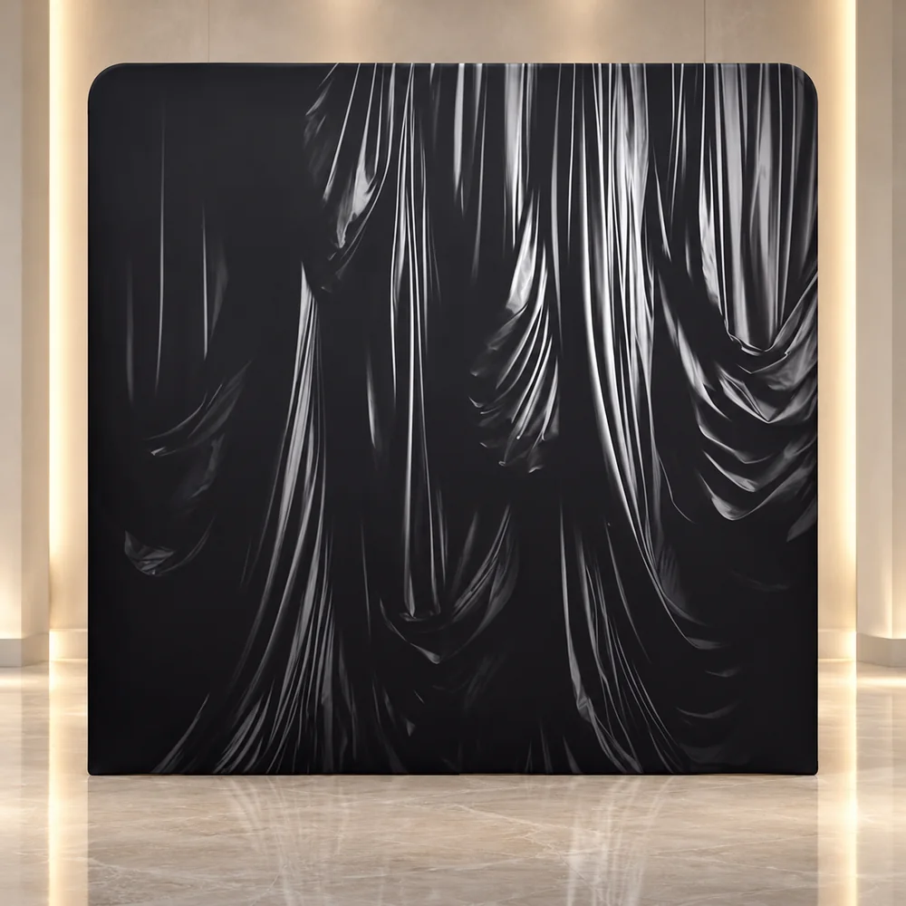 Midnight Drapery premium photo booth backdrop displayed in a luxury showroom