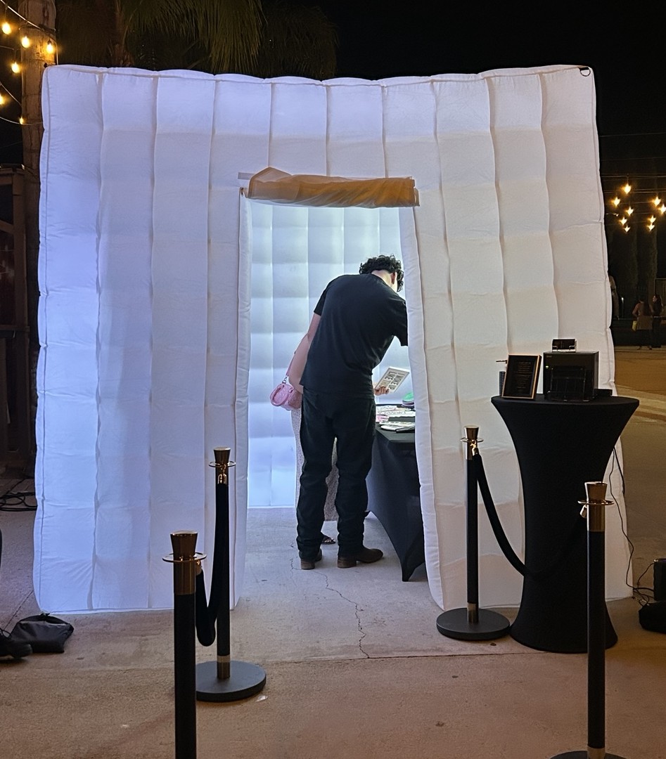 Studio RDRGZ LA inflatable LED photo booth setup at a nighttime event