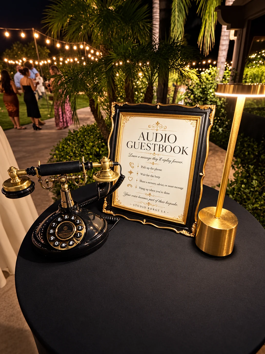 Studio RDRGZ LA vintage audio guestbook phone, framed instructions and warm table lamp at a real evening wedding