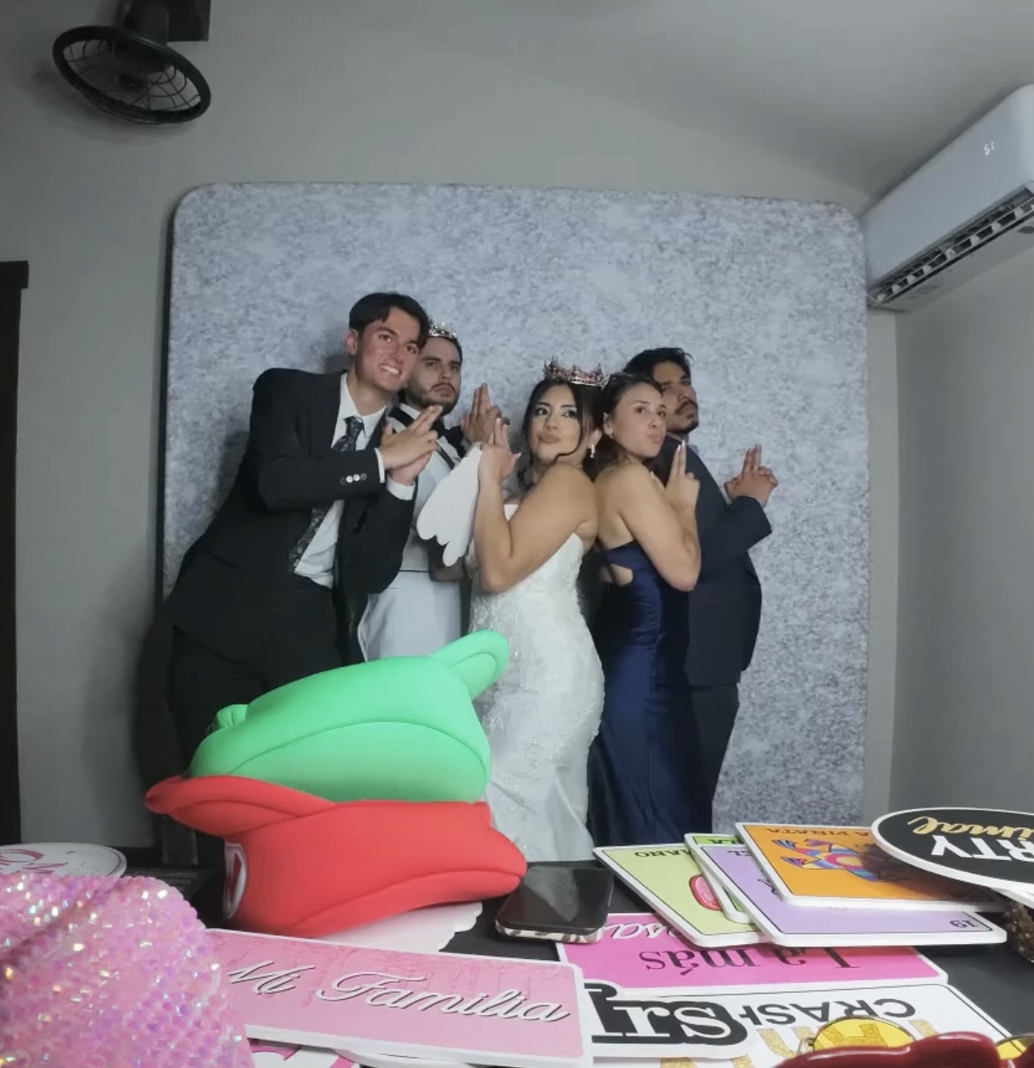 Guests enjoying Abel and Myra's wedding photo booth in Redlands
