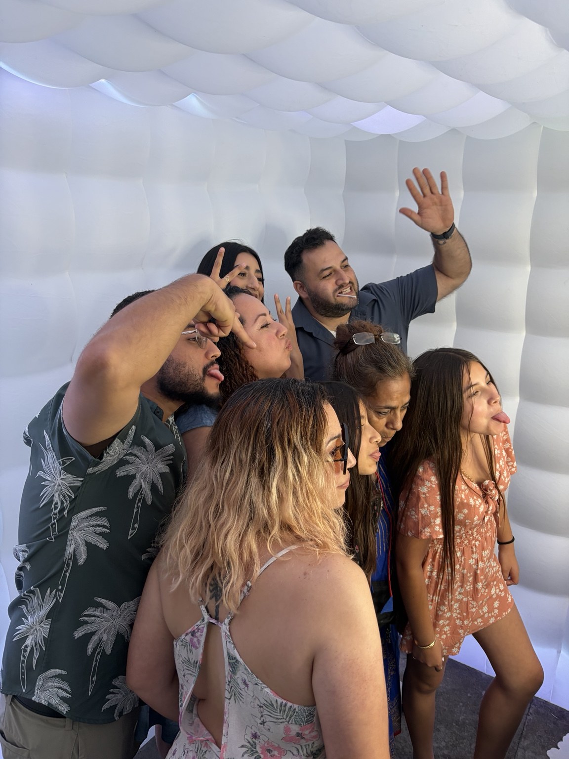 Mateo Benjamin's Baptism guests enjoying the Classic Booth and White Inflatable by Studio RDRGZ LA