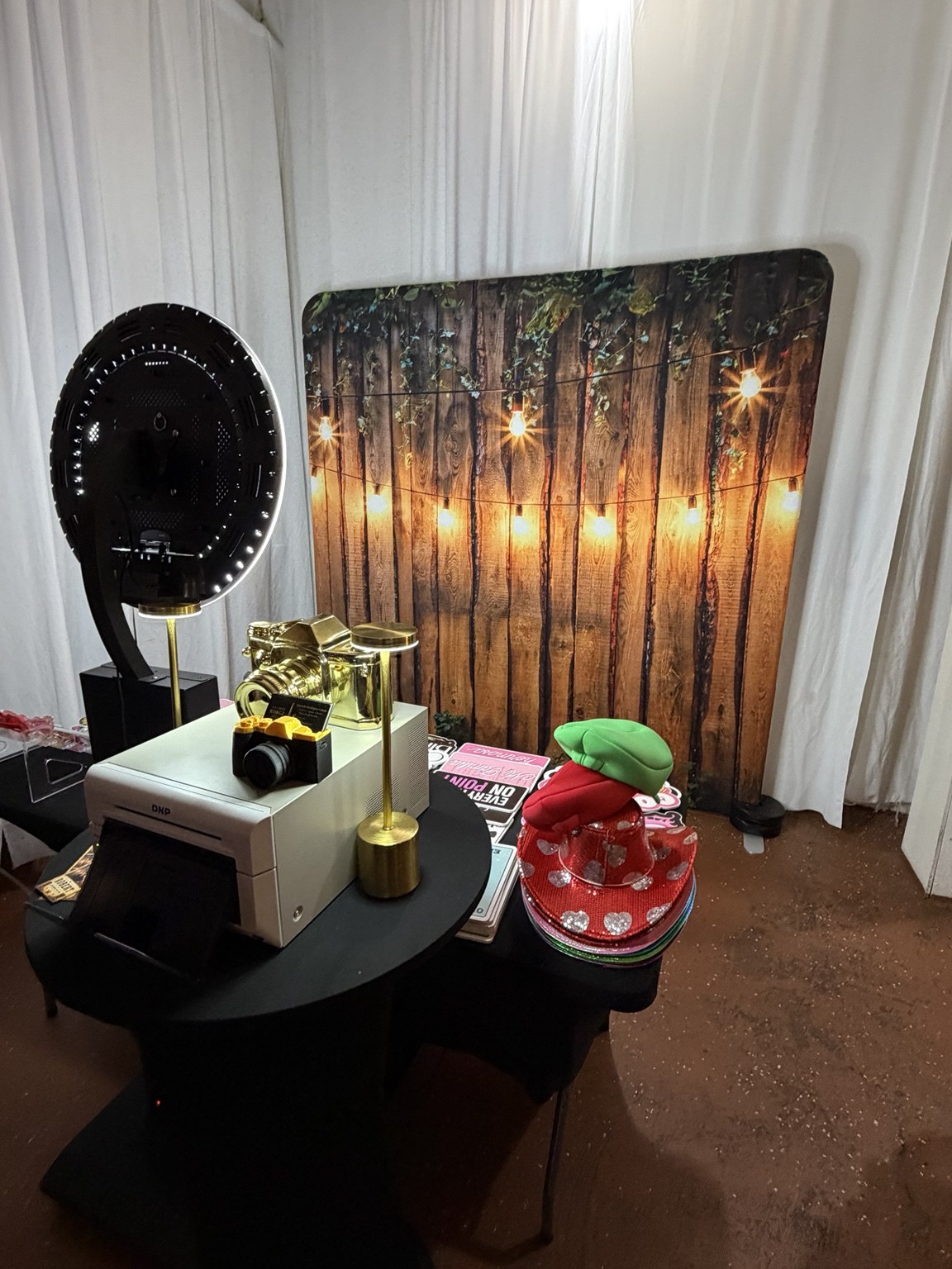 Robert's Rodeo Classic Photo Booth setup with Rustic Glow backdrop